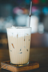 Glass of iced coffee cappuccino with straw