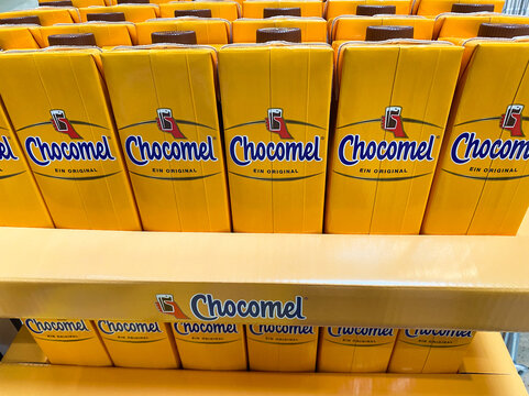 Viersen, Germany - July 9. 2020: View on isolated yellow bottles in a row with dutch chocolate drink Chocomel (focus on upper row)