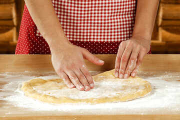 Obraz na płótnie Canvas Woman hands making pizza 