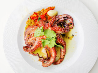 Mediterranean Octopus with vegetables and potatoes