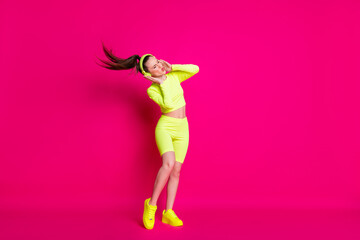 Fototapeta na wymiar Full length body size view of her she nice attractive thin slender dreamy glad girl listening pop melody music having fun rest chill isolated bright vivid shine vibrant pink fuchsia color background