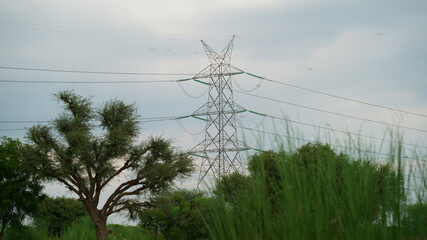 Electrical transmission tower on sky background