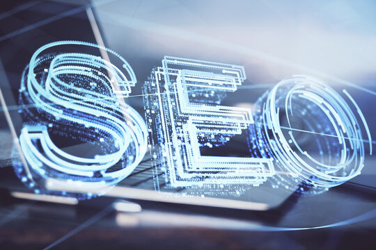 Multi exposure of table with computer and seo drawing hologram. Search optimization concept.