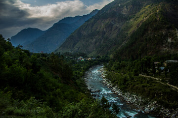 Naklejka na ściany i meble River running in the Tirthan Valley