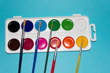 Colourful watercolour paints isolated