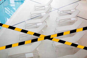 Quarantined public area, swimming pool closed caused by pandemic disease situation. Quarantine globally spread infection. Stop COVID-19 or 2019-ncov coronavirus line restricted areas, no entry concept