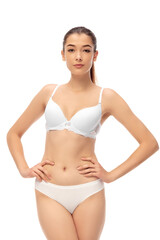 Fototapeta premium Beautiful female model isolated on white background. Beauty, cosmetics, spa, depilation, diet and treatment and fitness concept. Fit and sportive, sensual body with well-kept skin in underwear.