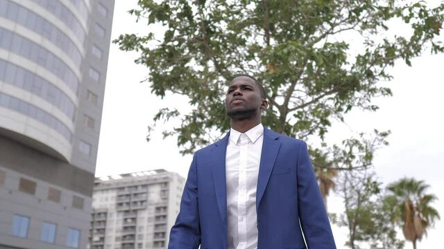 Businessman checking the time in city