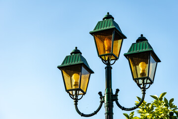 Fototapeta na wymiar Three lanterns with green roofs
