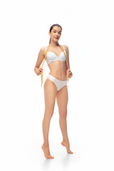 Beautiful female model isolated on white background. Beauty, cosmetics, spa, depilation, diet and treatment and fitness concept. Fit and sportive, sensual body with well-kept skin in underwear.