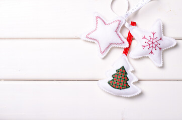 Christmas decorations with stars and tree on white wooden background. Xmas and Happy New Year composition
