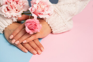 Beautiful woman's hands on background