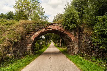 Old German bridge across the road. The bridge of the Rominten Forest. Vishtynetskoe lake....