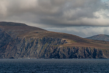 Cape Horn, Wollaston Islands, Chile - December 14, 2008: Closeup of Island cliffs behind blue ocean...