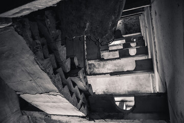 Crashed concrete staircase in abandoned building