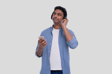 Indian Man Listening to Music from Phone Enjoying it. Man Listening to the Music.