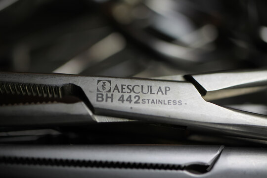 Viersen, Germany - July 9. 2020: Makro closeup of surgical stainless steel clamp from german manufacturer for surgery instruments aesculap (focus on center)