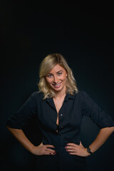 Beautiful young blonde woman with blue eyes isolated on back 