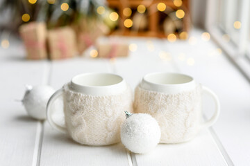 Beautiful multi-colored Christmas decorations on a light wooden table