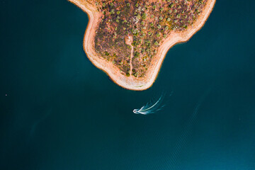 Boat following coastline