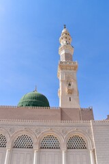 Fototapeta na wymiar Green dome and minaret of the mosque Al-Masjid an-Nabawi, Medina, Saudi Arabia, KSA
