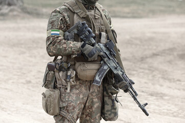 Soldier with assault rifle and flag of Sierra Leone on military uniform. Collage.