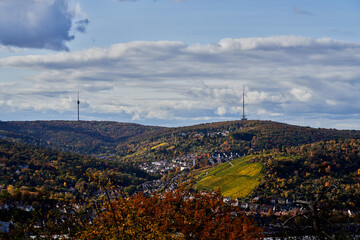 Stuttgart TV tower and radio tower are enthroned above the autumn forest and vineyard with landscape of Stuttgart Hedelfingen and Heumaden in fall
