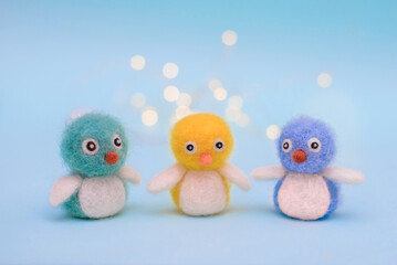 Small felt multi-colored birds