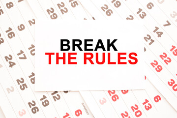 text BREAK THE RULES on a sheet from Notepad.a digital background. business concept . business and Finance.