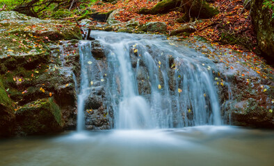 Fototapeta na wymiar closeup huge waterfall on a mountain river