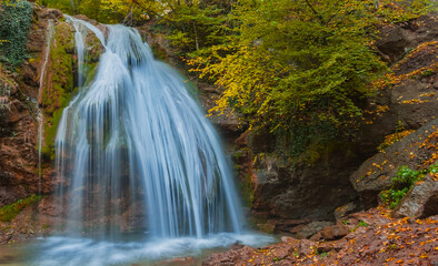 Fototapeta na wymiar closeup huge waterfall on a mountain river