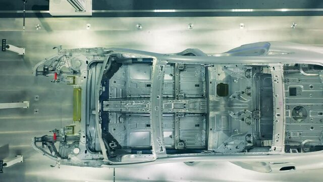 Top view of car body framework. Automotive factory equipment.