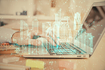 High tech city drawing with businessman working on computer on background. Smartcity concept. Double exposure.