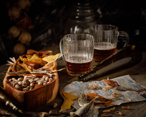 still life with beer, pictachios, almond and beer snacks