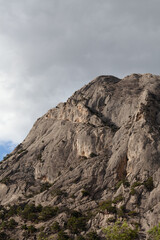 The top of the mountain against the background of clouds