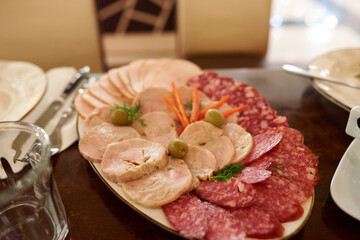 Lunch meats are precooked or cured ones that are sliced and served cold or hot