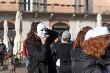 OCTOBER 30, 2020 - BRESCIA, ITALY: Girls in a theatrical mask in a manifestation of show business...