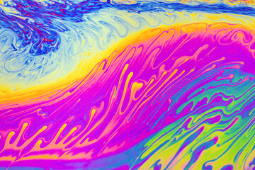 Psychedelic multicolored patterns background. Photo macro shot of soap bubbles
