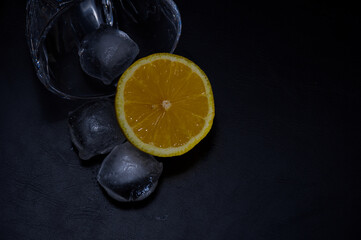 Glass with Ice Cubes and Lemon
