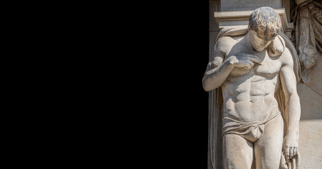 Banner with statue of powerful and emotional atlas of Renaissance Era as support for building facade in Dresden historical and shopping downtown, Germany, at black background with copy space.