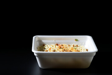 Dry instant noodles in rectangle plastic plate, top view
