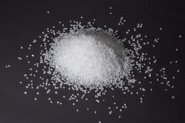 Heap of coarse salt on darck background