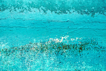 close up of faded turquoise colored paint on metal
