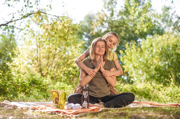 Woman masseuse adequately performs a great massage in the calm outdoors.