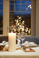 Nicely served New Year's table in the restaurant. Christmas night in a cafe or at home. Stock photo for design