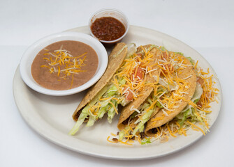 Hard Tacos, Refried Beans and a side of salsa
