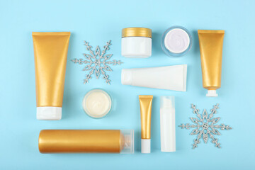 Winter care cosmetics on a colored background top view. set of cosmetics for winter care
