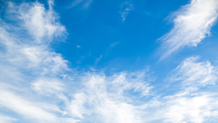 Blue sky with wispy white clouds
