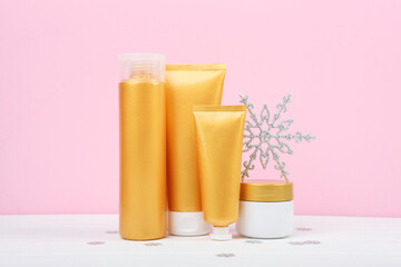 Winter care cosmetics on a colored background top view. set of cosmetics for winter care
