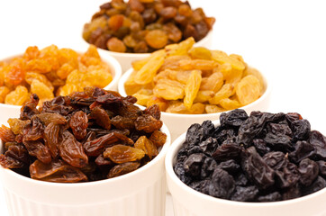 Plates with multi-colored appetizing raisins in white plates